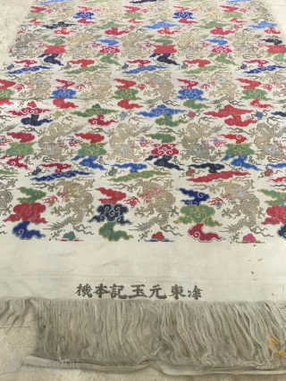 A Qing Dynasty embroidery brocade from China in the early 19th century

On the white silk and satin, the silk is weaved with colorful silk thread, and the golden dragon is weaved with  ...