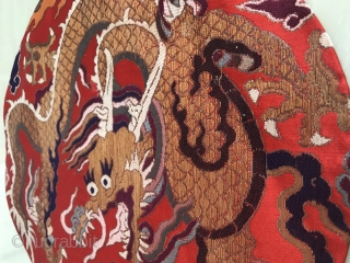 An official tonic of embroidery troupe dragon in Qing Dynasty from China in the late 18th century

A golden dragon with five claws was woven with gold thread on a piece of red  ...