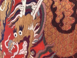 An official tonic of embroidery troupe dragon in Qing Dynasty from China in the late 18th century

A golden dragon with five claws was woven with gold thread on a piece of red  ...