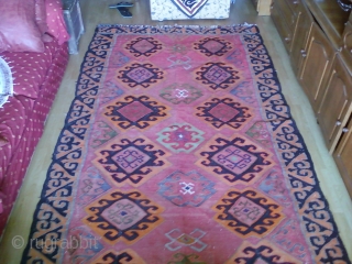 Kilim supposedly woven after WWII in Kazakhstan by people from Caucasus. Outer border design is common in artefacts from Kazakhstan but it is surprisingly based on silk. comments welcomed.    
