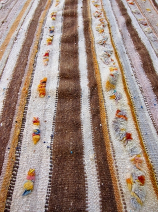 SOLD - A ca. 1970 Moroccan hanbel with a field striped in earth tones and pops of color in turquoise, tangerine and more. Minimal pattern of pile construction. 
Weft is wool -  ...