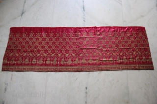 A beautiful full-length Ghaghra (skirt) cloth from Kutch, Gujarat.

The red satin silk Ghaghra is decorated with floral motifs as well as peacocks and female figures under arches at the hem. The border  ...