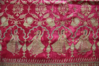 A beautiful full-length Ghaghra (skirt) cloth from Kutch, Gujarat.

The red satin silk Ghaghra is decorated with floral motifs as well as peacocks and female figures under arches at the hem. The border  ...