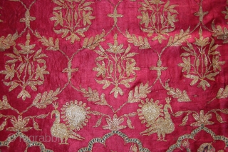 A beautiful full-length Ghaghra (skirt) cloth from Kutch, Gujarat.

The red satin silk Ghaghra is decorated with floral motifs as well as peacocks and female figures under arches at the hem. The border  ...