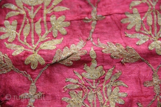 A beautiful full-length Ghaghra (skirt) cloth from Kutch, Gujarat.

The red satin silk Ghaghra is decorated with floral motifs as well as peacocks and female figures under arches at the hem. The border  ...