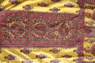 A wonderful example of Mochi embroidery from Kutch, Gujarat. This yellow satin silk wedding coat is beautifully decorated in chain stitch all over to depict parrots and floral motifs. The front pocket  ...