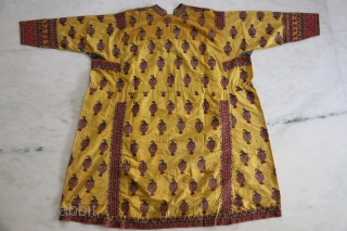 A wonderful example of Mochi embroidery from Kutch, Gujarat. This yellow satin silk wedding coat is beautifully decorated in chain stitch all over to depict parrots and floral motifs. The front pocket  ...