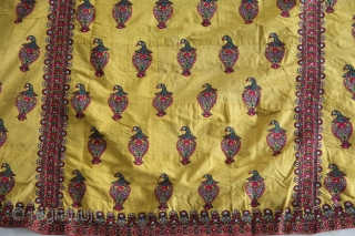 A wonderful example of Mochi embroidery from Kutch, Gujarat. This yellow satin silk wedding coat is beautifully decorated in chain stitch all over to depict parrots and floral motifs. The front pocket  ...