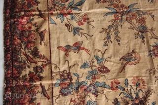 An extremely rare large sized colourful Palampore block-print textile richly decorated with a tree bearing flowers and fruits, flanked by two smaller plants and surrounded by flowers, resting birds, birds in flight,  ...