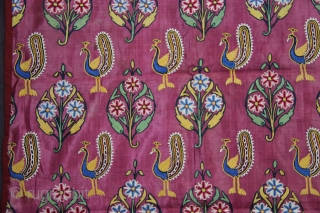A fine piece of Mochi embroidery textile on maroon satin silk decorated with typical peacock and floral motifs.               