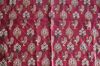 A lovely Mochi embroidery textile in maroon satin silk decorated in chain-stitch with peacock and floral motifs.                