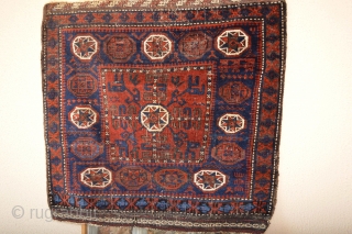 Beautiful 1880's Pinwheel Border Baluch Bagface, Goodsaturated colors Electric Blue Pinwheels with 8 white stars.. Orginal Kilim ends, 
Telling a Bigstory Patern Check and see:)
 Coroded Black/Brown 
size 84 x 79 centimeters 