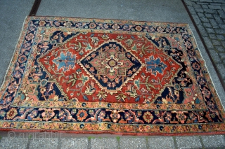 This lovely little rug from Heriz in north west persia was made in the first quarter from the 20 century circa 1900-1920.Good pile some low spots. not worn.Good natural colors. Rare in  ...