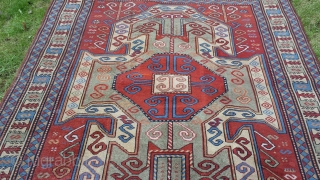 Old perez shield kazak design rug. Some areas of low pile and slight wear. Sides over woolled. Very attractive rug. 7ft 2' x 5 ft 8' (220cm x 123cm). £1500 o.n.o. plus  ...