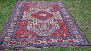 Old perez shield kazak design rug. Some areas of low pile and slight wear. Sides over woolled. Very attractive rug. 7ft 2' x 5 ft 8' (220cm x 123cm). £1500 o.n.o. plus  ...