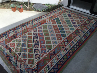 Qashqai kilim in good condition, ready for use. Decorative white ground with pastel colours. A few small stains, as shown in the last photo. 110" x 65" (280 cm x 165 cm).  ...