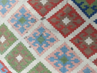 Quashqai kilim, probably mid 20th century. Decorative pastel palette with white ground. Minor stains as shown. Ready for use. 110 x 65 inches (280 x 165 cm).      