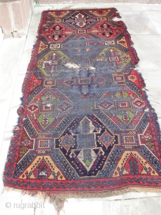 Sarkisla kurdish rug, 310 x 140 cm. Outstanding colour, blue weft, extensive off-set knotting. Battered and worn, but intact and restorable. Only four other examples of this type are recorded in carpet  ...