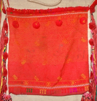 Kachin "n'hpye" shoulder bag,North Burma,cotton and small amount of metallic thread.
the beads where the dangles attach to bag are plastic so probably 1960-1980, some small dirty spots,not that noticeable..29x29(body of bag)..good strong  ...