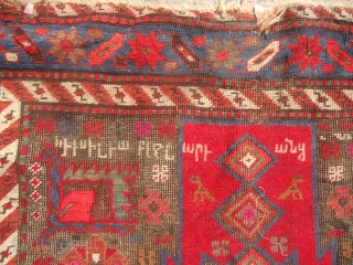 Karabagh Rug Fragment with inscription and date,not ofr the condition conscious,good design colors and age.Size 5'5"*3'5".e.mail for more info and pics.            