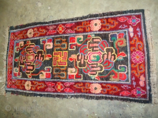 Tibet Rug with some synthetic colours but authentic design, Fine condition,Size 5*2'6".Handwashed ready for use.                  