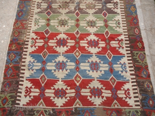 An early Anatolian Kilim  with great colors and metal thread used,fine weave and good design with beautiful border.Size 12'4"*4'10".E.mail for more info.          