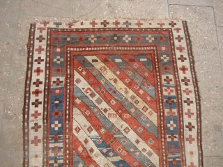 Early Caucasian Rug with great natural colors and beautiful design.As found without any repair or work done.Size 5'10"*3'1".E.mail for more info and pics.          