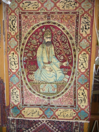 Lavar-Kerman Pictureal Hanging Rug of good age,very fine weave and good colours.With a nice picture of a man holing a pen and some inscriptions all over the border.Size 24*25 inches.E.mail for more  ...