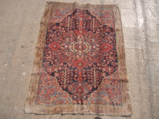 Colorfull carpets fragment with a face figeure in the middle,great natural colors and early age,as found.Size 4'8"*3'7".E.mail for more info and pics.           