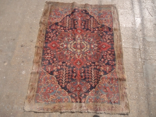 Colorfull carpets fragment with a face figeure in the middle,great natural colors and early age,as found.Size 4'8"*3'7".E.mail for more info and pics.           