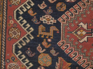 Antique Qashqai rug with triple medallion design, the medallions contain a large scale heratti design, this also has elements repeated in the field. 

Circa 1900.

There are also many small birds, animals and  ...