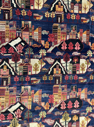 10½ x 13 ft (315 x 390 cm) Afghan war rug from the 1980s. Collector's item, with Kamov helicopters, limousines (Zil?), tanks (T-72?), airplanes (Su-24?), apartment blocks, and civilian and military vehicles.  ...