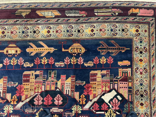 10½ x 13 ft (315 x 390 cm) Afghan war rug from the 1980s. Collector's item, with Kamov helicopters, limousines (Zil?), tanks (T-72?), airplanes (Su-24?), apartment blocks, and civilian and military vehicles.  ...