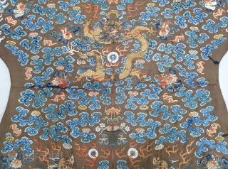 A very large and Beautiful Imperial Chinese dragon robe. Kesi woven with 9 dragons in pursuit of pearls among multicolour silk clouds, bats, and daoist symbols above wave and rock band. 19th  ...