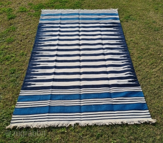 Jail Dhurrie, Indigo Blue-White striped, Hand Spun Cotton, From Bikaner ,Rajasthan ,
India. India.
This Kind of Jail Dhurrie’s were made in Indian prisons during British rule to India.
C.1920-1940.
Its size is 145cmX248cm (20220129_143843).
  