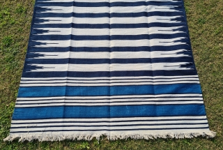 Jail Dhurrie, Indigo Blue-White striped, Hand Spun Cotton, From Bikaner ,Rajasthan ,
India. India.
This Kind of Jail Dhurrie’s were made in Indian prisons during British rule to India.
C.1920-1940.
Its size is 145cmX248cm (20220129_143843).
  