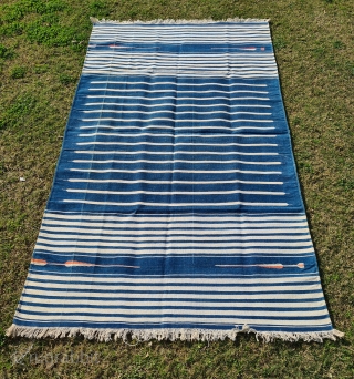 Jail Dhurrie, Indigo Blue-White striped, Hand Spun Cotton, From Bikaner Rajasthan , India. India.

These Kinds of Jail Dhurrie’s were made in Indian prisons during British rule in India.

C.1920-1940.

Its size is 112cmX195cm(20220129_144041)  