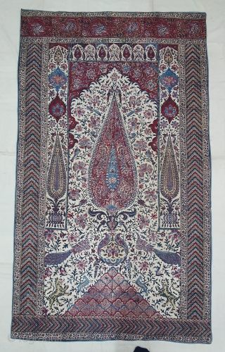 Kalamkari Palampore from South India. India. Made for Export Market, Printed cotton with exotic birds, peacocks, tigers, stylized mountain and cypress trees all within mihrab. Surrounded by lozenge border Cotton backing. Late  ...