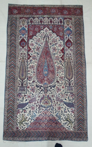 Kalamkari Palampore from South India. India. Made for Export Market, Printed cotton with exotic birds, peacocks, tigers, stylized mountain and cypress trees all within mihrab. Surrounded by lozenge border Cotton backing. Late  ...