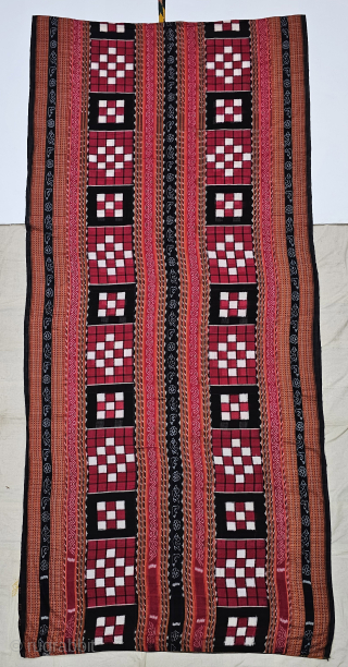 An Rare Cotton Dashphulia Saktapaar Domuha Saree From  West Odisha.

Plain weave with compound and double ikat, supplementary warp and continuous supplementary weft

20th Century 

120cm x 510cms

The checkerboard pattern in the field  ...