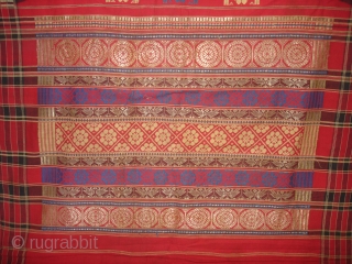 Temple Sari From Orissa, an eastern state India,on the Bay of Bengal.Sari is made of red cotton bordered by black stripes,the plain weave supplemented by bands of both warp and weft.Its size  ...