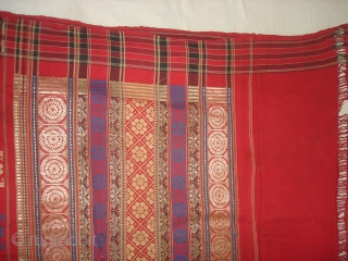 Temple Sari From Orissa, an eastern state India,on the Bay of Bengal.Sari is made of red cotton bordered by black stripes,the plain weave supplemented by bands of both warp and weft.Its size  ...