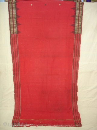 Temple Sari From Orissa, an eastern state India,on the Bay of Bengal.Sari is made of red cotton bordered by black stripes,the plain weave supplemented by bands of both warp and weft.Its size  ...