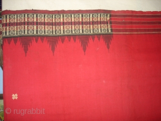 Temple Sari From Orissa, an eastern state India,on the Bay of Bengal.Sari is made of red cotton bordered by black stripes,the plain weave supplemented by bands of both warp and weft.Its size  ...