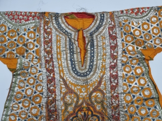 Ceremonial Kurta, Women's Costume, From Himachal Pradesh India. A Orange Kurta With Dazzling Embroidery using Gota and Coloured fabric Strips, Silk ground with Real Zari Gota Pati work And Real Zari Embroidery. 

Late 19th Century.

Its size  ...