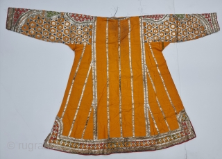 Ceremonial Kurta, Women's Costume, From Himachal Pradesh India. A Orange Kurta With Dazzling Embroidery using Gota and Coloured fabric Strips, Silk ground with Real Zari Gota Pati work And Real Zari Embroidery. 

Late 19th Century.

Its size  ...