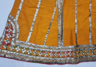 Ceremonial Kurta, Women's Costume, From Himachal Pradesh India. A Orange Kurta With Dazzling Embroidery using Gota and Coloured fabric Strips, Silk ground with Real Zari Gota Pati work And Real Zari Embroidery. 

Late 19th Century.

Its size  ...