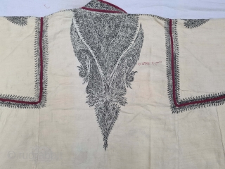 A Kashmir Embroidery Choga (Coat) Borders with Keri butis, From Kashmir, India. India. There are imitation pockets in the front and similar motifs on the sleeves, The back and Shoulders are Decorated with Elaborate  ...