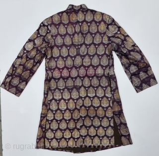 An very Unique Achkan (Coat) Real Zari Brocade (Real Zari)  With Fine Floral Butas in Weaving on Gold and Silver Thread  Lined with Cotton From the Varanasi Uttar Pradesh, India.
C.1900-1925. 
Its size is  ...