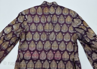 An very Unique Achkan (Coat) Real Zari Brocade (Real Zari)  With Fine Floral Butas in Weaving on Gold and Silver Thread  Lined with Cotton From the Varanasi Uttar Pradesh, India.
C.1900-1925. 
Its size is  ...